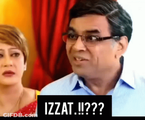 Man With Glasses Next To Woman And Izzat Sign GIF