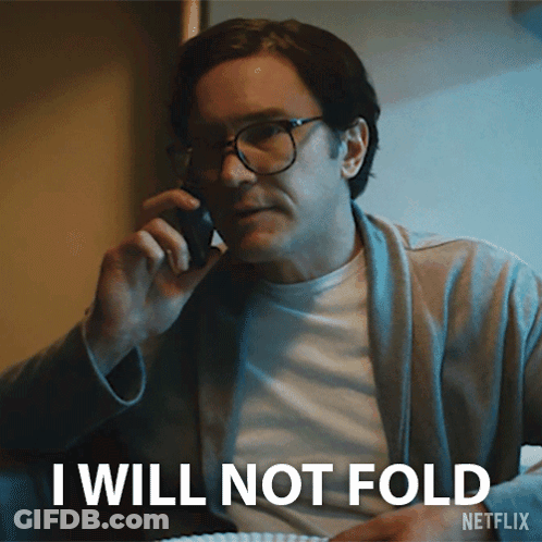 Man With Glasses On Phone Saying I Will Not Fold GIF