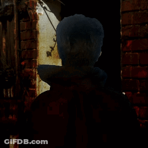 Man With Glasses Open Mouth At Brick Wall GIF