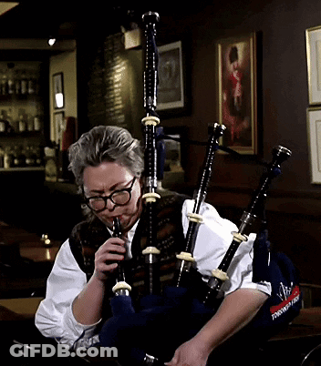 Man With Glasses Playing Bagpipes Saying Scottish GIF