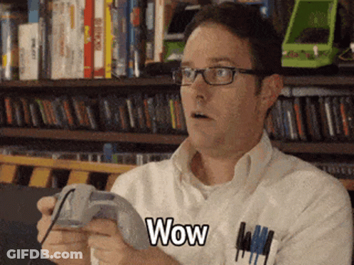 Man With Glasses Playing Game Says Wow GIF