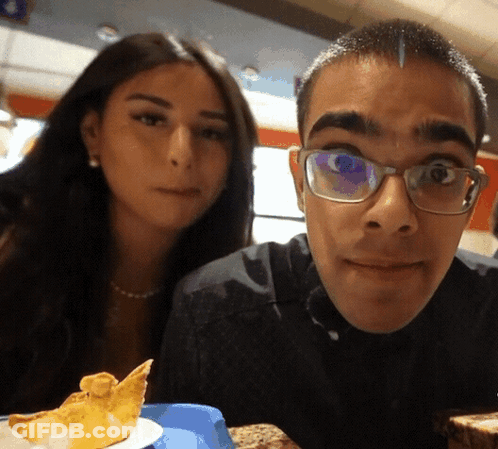 Man With Glasses Posing With Woman GIF