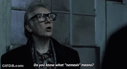 Man With Glasses Saying Do You Know What Nemesis Means GIF