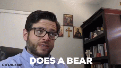 Man With Glasses Saying Does A Bear GIF
