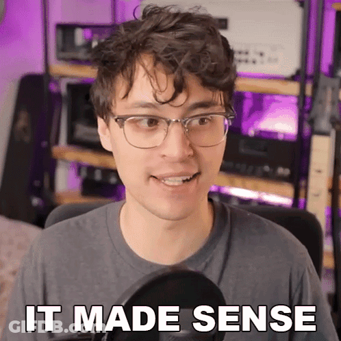 Man With Glasses Says It Made Sense At Microphone GIF
