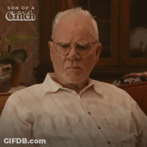 Man With Glasses Says Relax In Front Of Son Of A Gitch Logo GIF