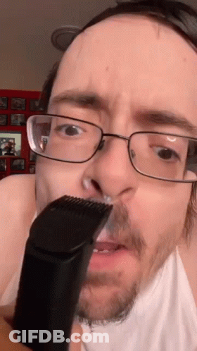 Man With Glasses Shaving His Nose GIF