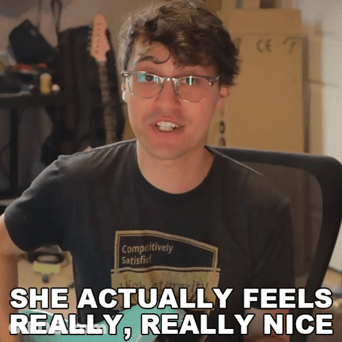 Man With Glasses Shirt Says Competitively Satisfied GIF