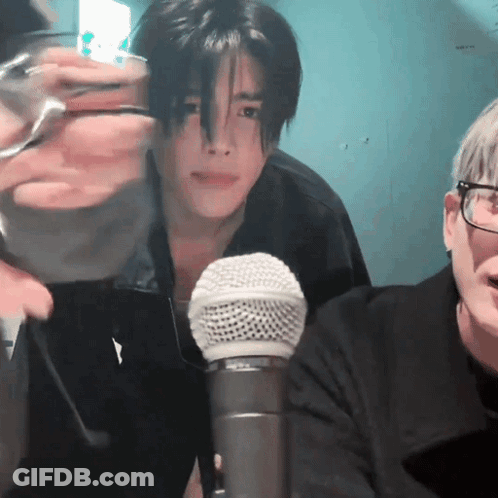 Man With Glasses Sitting At Microphone GIF