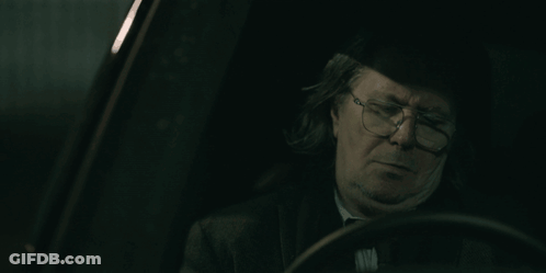 Man With Glasses Sitting In Dark Car GIF