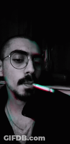 Man With Glasses Smoking Cigarette GIF
