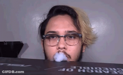Man With Glasses Smoking Cigarette GIF