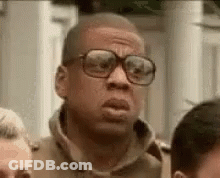 Man With Glasses Standing In Crowd GIF