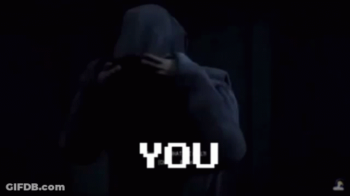 Man With Glasses Standing In Dark Room Monk GIF