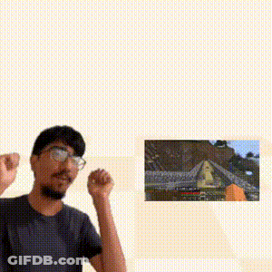 Man With Glasses Standing In Front Of Video Game Picture GIF