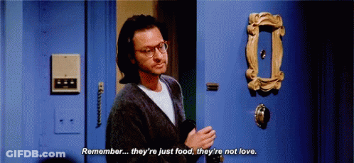 Man With Glasses Talking In Front Of Blue Door GIF
