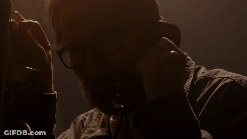 Man With Glasses Talking On Phone Saying Please GIF