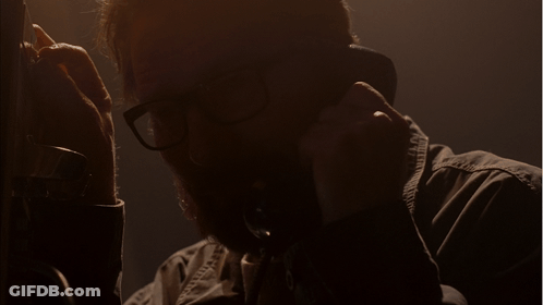Man With Glasses Talking On Phone Saying Please GIF