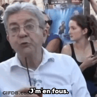 Man With Glasses Talking To Crowd Holding Straw GIF