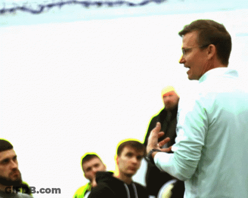 Man With Glasses Talks To Men GIF
