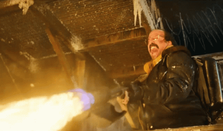 Man With Glasses Using Flamethrower GIF