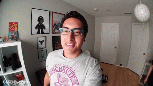 Man With Glasses Wearing Schrutte Shirt GIF