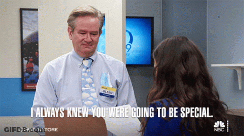 Man With Glenn Name Tag Talks To Woman GIF