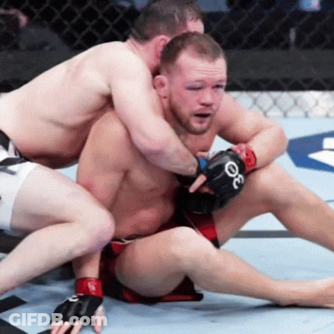 Man With Gloves Letter O Wrestling Another Man GIF