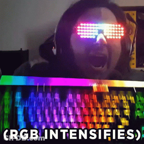 Man With Glowing Glasses At Rainbow Keyboard GIF