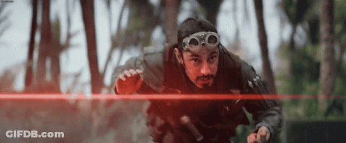 Man With Goggles And Beard Holding Red Laser GIF