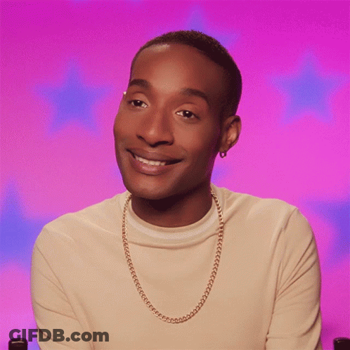 Man With Gold Chain Smiles GIF