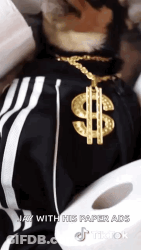 Man With Gold Dollar Sign Necklace Next To Toilet Paper Roll GIF