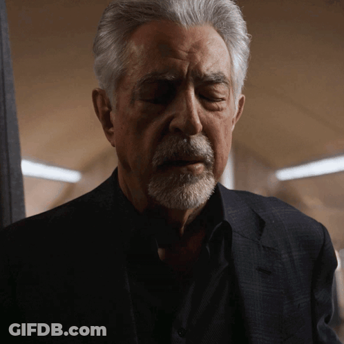Man With Gray Hair And Beard In Black Shirt And Suit GIF