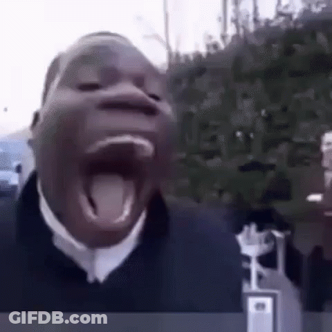 Man With Gray Hair And Beard In Black Suit And Tie GIF