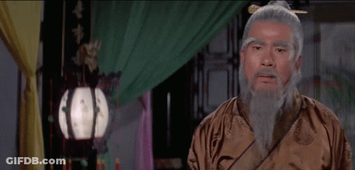 Man With Gray Hair And Beard In Brown Robe GIF