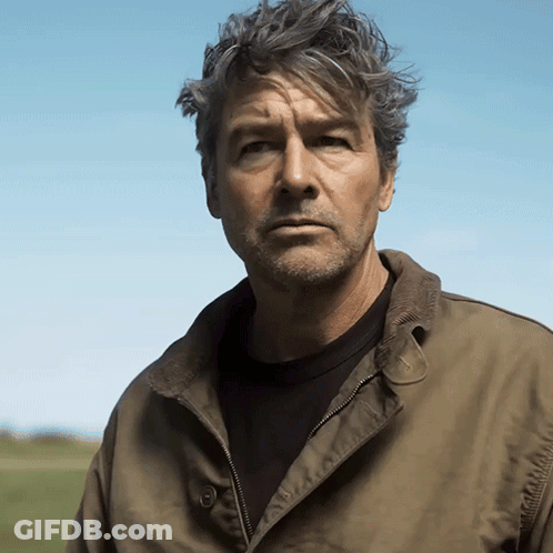 Man With Gray Hair And Beard In Green Jacket GIF
