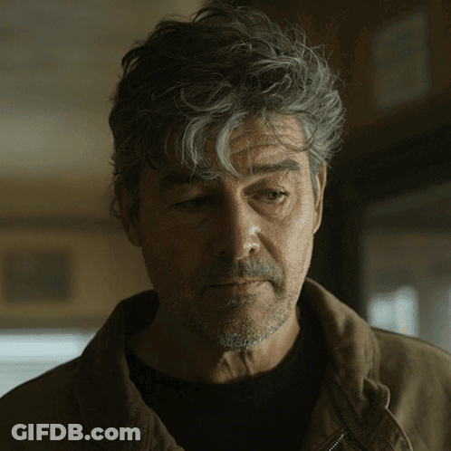 Man With Gray Hair And Beard Looking Down GIF