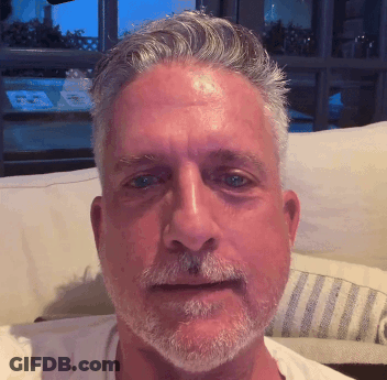 Man With Gray Hair And Beard Sitting GIF