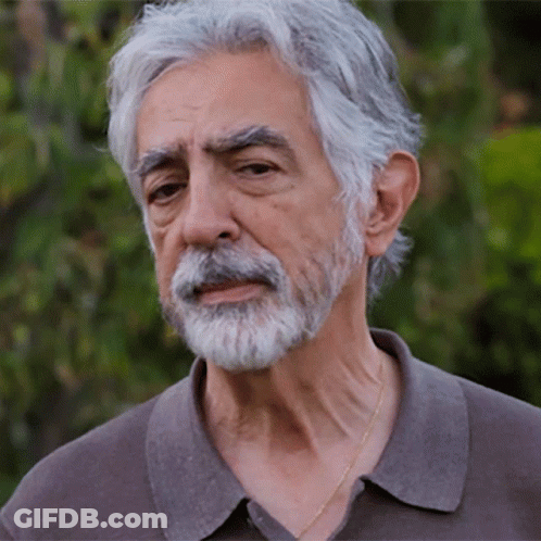 Man With Gray Hair And Beard Wearing Grey Shirt GIF