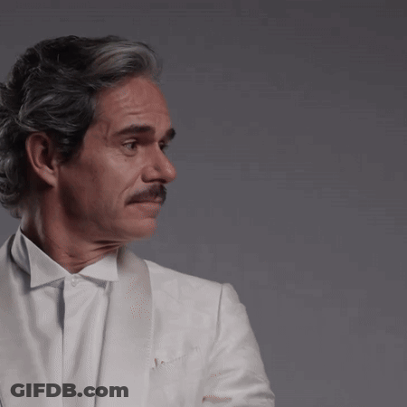Man With Gray Hair And Mustache In White Jacket GIF