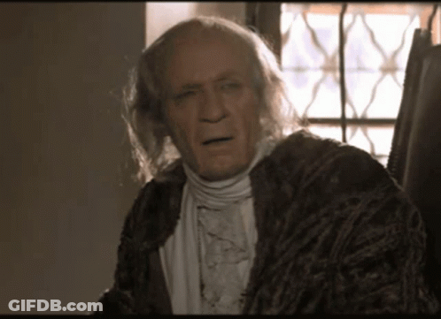 Man With Gray Hair In Brown Robe GIF