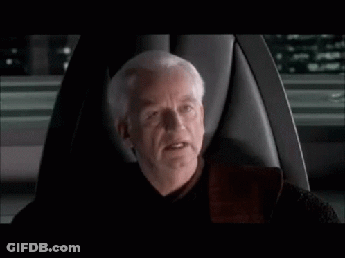 Man With Gray Hair Sitting In Chair Talking GIF