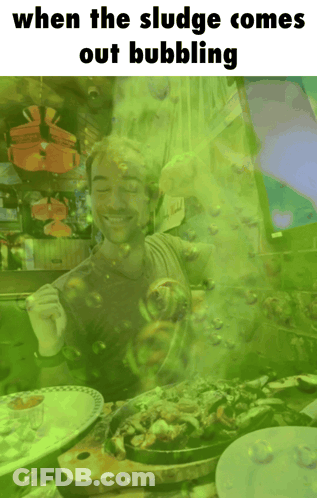 Man With Green Bubbles Coming Out Of Mouth When The Sludge Comes Out Bubbling GIF