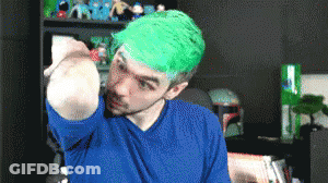 Man With Green Hair And Blue Shirt Holding Something GIF