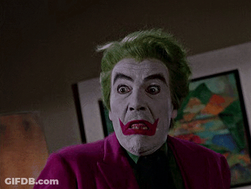 Man With Green Hair And White Face Paint In Purple Jacket GIF