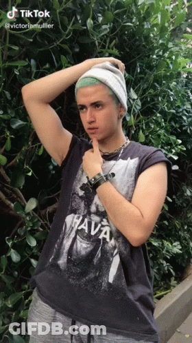 Man With Green Hair In Beanie And Vava T-Shirt GIF