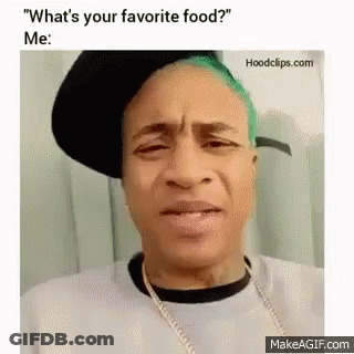 Man With Green Hair Making Funny Face Wearing Hat And Necklace GIF