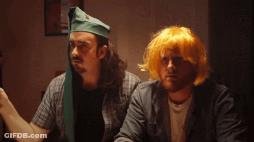 Man With Green Hat And Man With Yellow Hair GIF