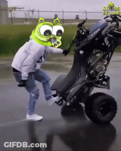 Man With Green Head Riding Four Wheeled Vehicle Cross Bit Me GIF