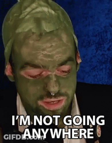 Man With Green Mask Making Funny Face GIF